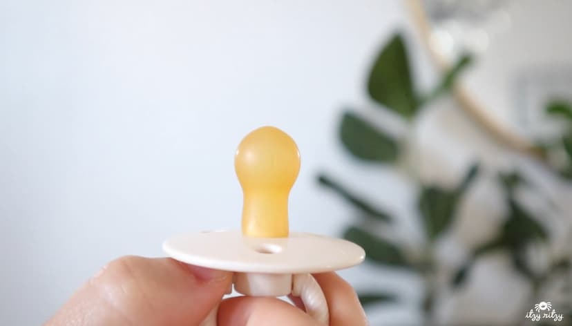 Itzy Ritzy Natural Rubber Newborn Pacifiers (Set of 2) – Baby Pacifiers with Cherry-Shaped Nipple & Large Air Holes for Added Safety; Set of 2 Binkies in Coconut & Toast (Ages 0 – 6 Months)