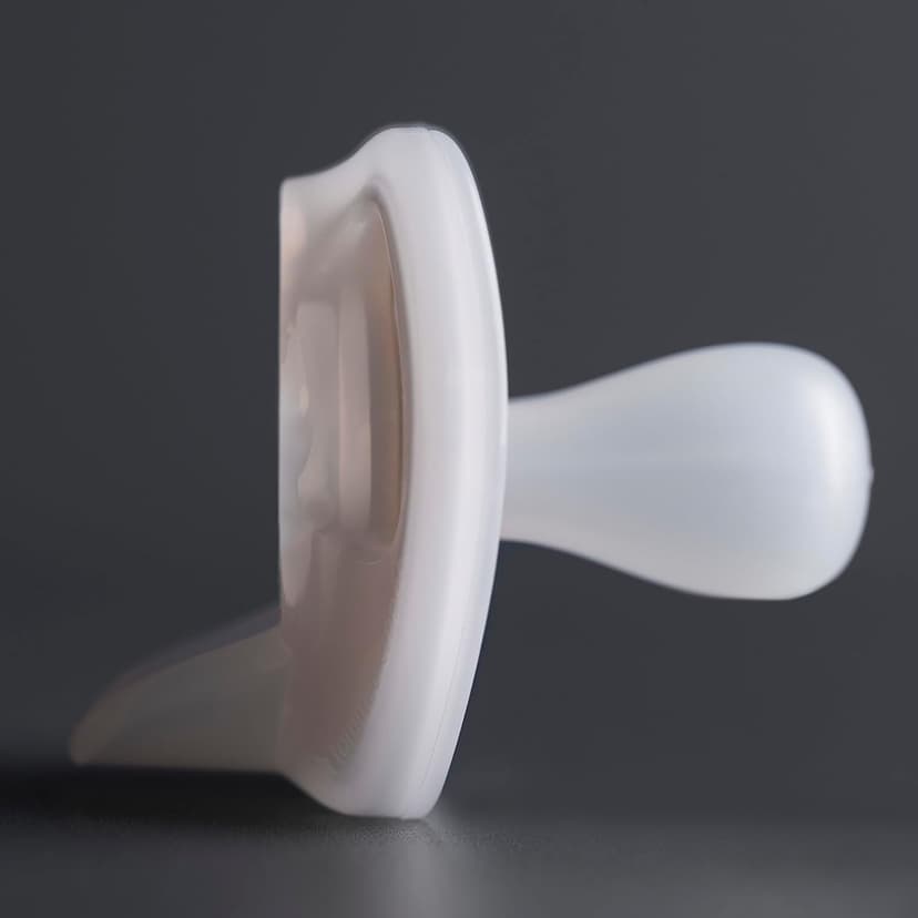 Tommee Tippee Ultra-Light Silicone Pacifier, 0-6 Months, Symmetrical One-Piece Design, BPA-Free Silicone Binkies, Clear/Blue/Green, Pack of 4