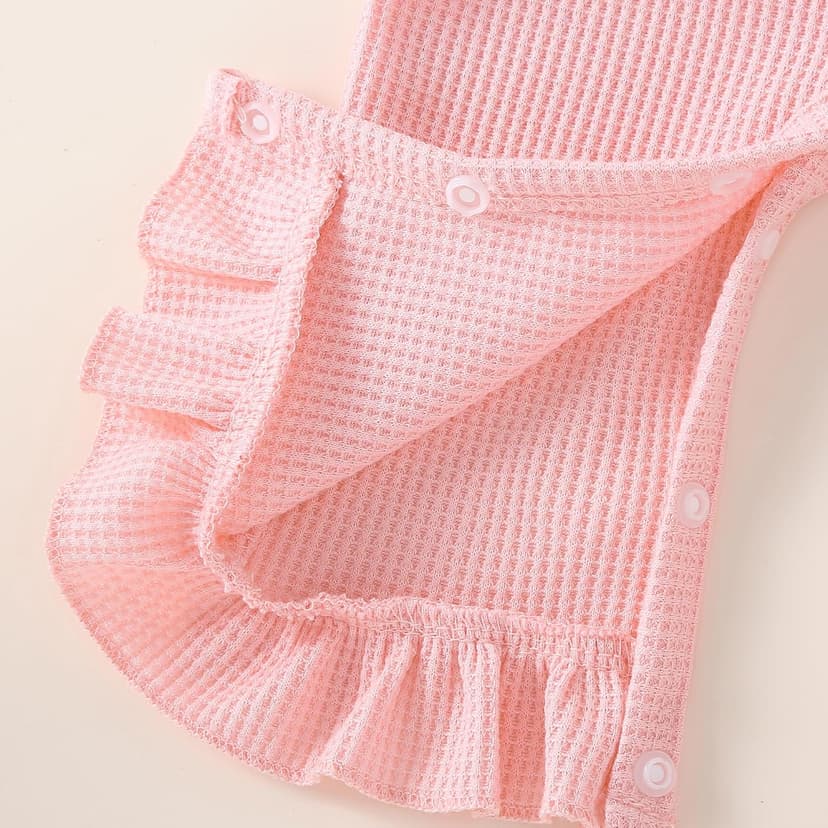 Soft waffle knit romper with ruffle trim, snap closure and matching bow headband QITUDATEY Baby Girl Waffle Knit Romper with Headband, Ruffle Jumpsuit B0HCKVJZZB