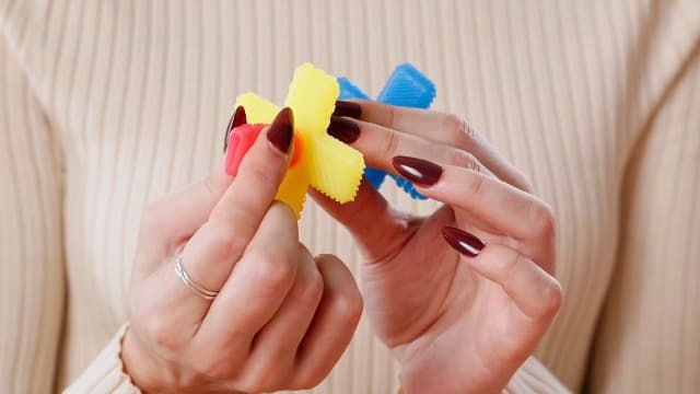 Itzy Ritzy Teensy Tube Teether – Textured Hollow Baby Teething Tube That Reaches Front Teeth & Back Molars, Made of Soft Silicone (Pink Rainbow)
