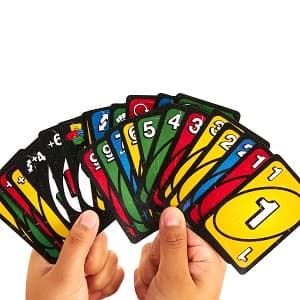 Mattel Games UNO Show ‘em No Mercy Card Game in Storage & Travel Tin for Kids, Adults & Family Night with Extra Cards, Special Rules & Tougher Penalties (Amazon Exclusive)