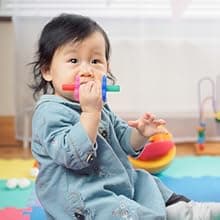 Itzy Ritzy Teensy Tube Teether – Textured Hollow Baby Teething Tube That Reaches Front Teeth & Back Molars, Made of Soft Silicone (Pink Rainbow)