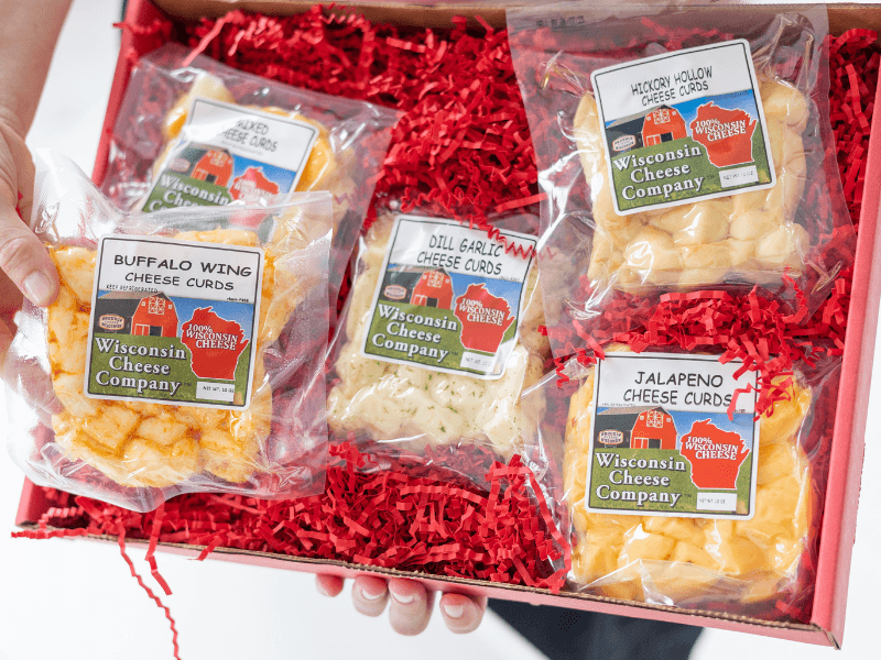 Wisconsin Cheese Company - Specialty 100% Wisconsin Cheese Block Assortment Sampler - (Pack of 7 Blocks) Cheddar, Pepper Jack, Swiss, Gouda, Salami, Smoked Cheddar & Tomato Basil | Locally Sourced | Perfect for Parties, Charcuterie Boards and Birthday Gifts | Great Birthday Gift for Cheese Lovers